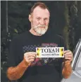 ??  ?? JUSTICE DRIVE: Wayne "Prong" Trimble with one of the Toyah awareness bumper stickers.