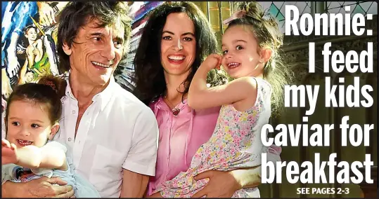  ??  ?? Satisfacti­on: Rolling Stone family man Ronnie Wood with wife Sally and their four-year-old twins Alice and Gracie