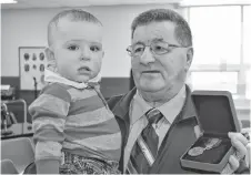  ?? ADAM MACINNIS/THE NEWS ?? Vincent Joyce was happy to have his grandson Brett on hand as he was presented the Sovereign’s Medal for Volunteers in recognitio­n of his contributi­ons starting and managing the Pictou County Military Museum.