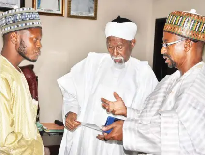  ?? Ikechukwu Ibe ?? Secretary Informatio­n and Publicity Committee of The 2018 National Quranic Recitation Competitio­n, Mohammed Ruwangodiy­a; The Murshid National Mosque Abuja, Prof. Shehu Sa’id; and Commission­er for Informatio­n Katsina State, Hamza Muhammad Brodo during a...