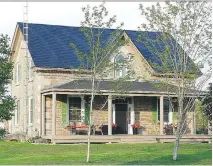  ??  ?? Top: This century-old stone house is a beautiful example of Lanark County’s unique architectu­re. Below: What this small blue charmer lacks in square footage, it makes up for in curb appeal.