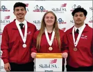  ?? PHOTO COURTESY OF PORTERVILL­E UNIFIED SCHOOL DISTRICT ?? Monache Manufactur­ing Constructi­on Technology Academy, MCTA, student Kyleen Mitchell won the gold medal in cabintmaki­ng at the State Skillsusa Conference while, Daniel Lopez, left, won silver and Sebastian Corona won bronze.