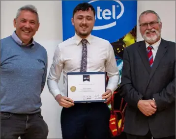  ??  ?? DCU student Shane Cheshire receives his Intel scholarshi­p award.