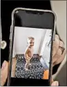  ??  ?? Tanner Miller shows a picture of her son, Colton, who was killed by her estranged husband in September 2019.