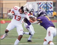  ?? Christian Abraham / Hearst Connecticu­t Media ?? Greenwich’s Chason Barber’s helmet comes off as he’s tackled by Westhill’s Kevin Laba in Stamford on Saturday.