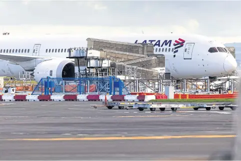  ?? AFP ?? The Latam Airlines Boeing 787 Dreamliner that suddenly lost altitude mid-flight is seen on the tarmac at Auckland Internatio­nal Airport yesterday.