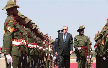  ??  ?? Erdogan reviews a guard of honour during a welcoming ceremony at the State House in Lusaka, Zambia. — Reuters photo