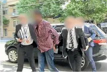  ?? PHOTO: VICTORIA POLICE/FAIRFAX ?? The 20-year-old man accused of planning a New Year’s Eve terror attack in Melbourne is taken into custody.