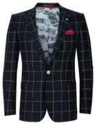  ??  ?? A Ted Baker Nostalg navy cotton check blazer ($595) can be a statement piece in a
wardrobe.