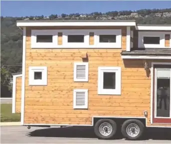  ??  ?? This Tiny House of Chattanoog­a model features French doors to increase natural lighting