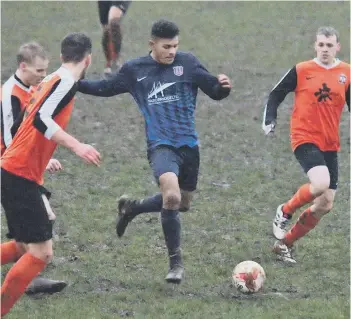  ??  ?? Angel’s man of the match Lloyd Henderson drives his side forward, chased by Danny Milne, right