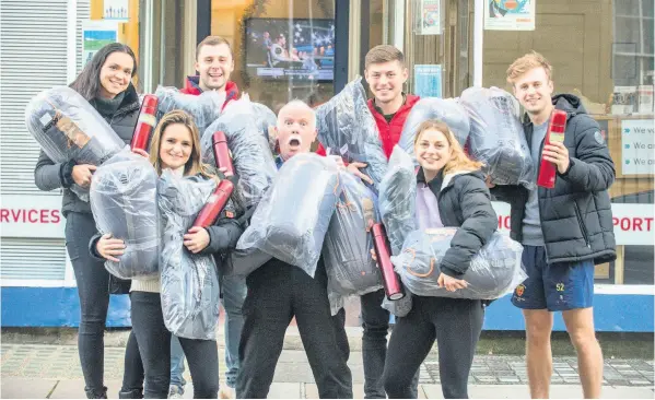  ?? Pic: Paul Gillis ?? Students with Cecil Weir of Julian House after raising £1,000 to buy sleeping bags, rucksacks and Thermos flasks for the homeless