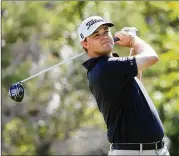  ?? SAM GREENWOOD / GETTY IMAGES ?? Patton Kizzire plays his shot from the first tee during the final round of the Sony Open at Waialae Country Club in Honolulu.