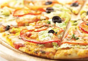  ?? STOCK.ADOBE.COM ?? When it comes to frozen pizza, opt for thin crust and veggie toppings to help curb the amount of salt and fat content. And add your own vegetables to make the pizza more filling.