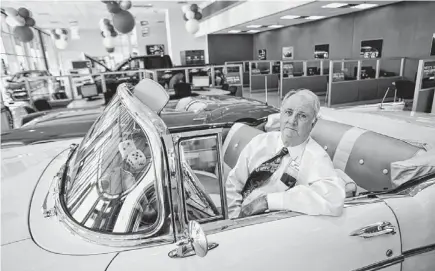  ?? DAVID WALLACE/THE REPUBLIC ?? Louis Sands IV, better known as Buzz Sands, sits in his 1957 Chevrolet Bel Air at Sands Chevrolet in Glendale. He has run the car-dealership business since his father died in 1975.