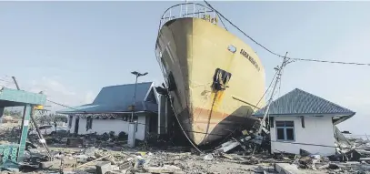  ?? Picture: Antara/Reuters ?? BATTERED. A ship stranded on the shore after an earthquake and tsunami hit the area in Wani, Donggala, Central Sulawesi, Indonesia on Monday.