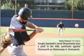  ??  ?? Haley Sawyer/The Signal Saugus baseball’s Jacob Beauchamp eyes a pitch in the VIBL semifinals against Chatsworth on Wednesday in Chatsworth.