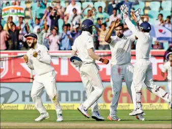  ??  ?? India captain Virat Kohli celebrates fall of a wicket during day two of the second Test between India and England in Visakhapat­nam on Nov 18, 2016.