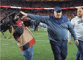  ?? JOSIE LEPE/AP ?? Cowboys coach Mike McCarthy pushes a cameraman away after a divisional round playoff game against the 49ers last year.