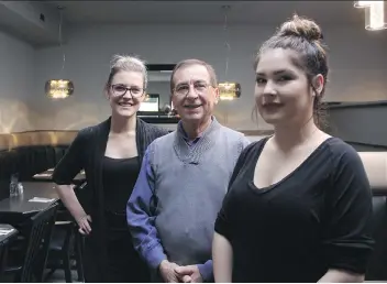  ?? MORGAN MODJESKI ?? Phillip Antoniadis, owner of Kisavos Restaurant and Lounge, chats waitresses Jill Sembalerus, left, and Shania Dolter at the newly renovated restaurant on Thursday. He said the re-design was a family effort as it was spearheade­d by his daughter and his...