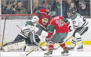  ?? JASON SIMMONDS/JOURNAL PIONEER ?? The Kensington Monaghan Farms Wild directed 45 shots at Charlottet­own Bulk Carriers Pride goaltender Erik MacInnis in Game 5 of the best-of-seven P.E.I. major midget hockey championsh­ip series on Saturday night. The Wild’s Landon Clow, in front of...