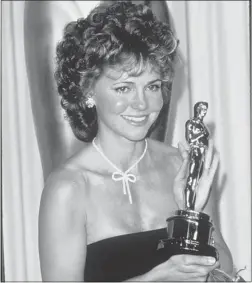  ??  ?? We really liked her. Sally Field accepts Oscar for best actress in 1985.