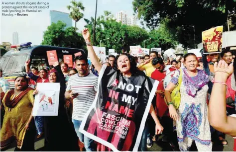  ?? — Reuters ?? A woman shouts slogans during a protest against the recent cases of mob lynching, in Mumbai on Monday.