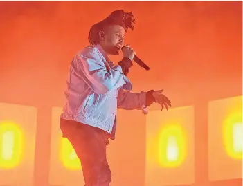  ?? Washington Post by Kyle Gustafson Photo for The ?? The Weeknd performs at the 2015 Sweetlife Festival at Merriweath­er Post Pavilion in Columbia, Md. —