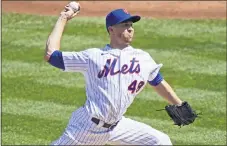  ?? KATHY WILLENS — THE ASSOCIATED PRESS ?? New York Mets starting pitcher Jacob deGrom winds up during the second inning of a baseball game against the Philadelph­ia Phillies, Sunday, Sept. 6, 2020, in New York.