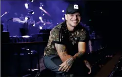  ?? AP PHOTO/MARK HUMPHREY ?? In this Sept. 22, photo, country singer Kane Brown poses in Nashville, Tenn. Brown’s 2016 self-titled debut album and its deluxe release last year spawned two multi-platinum hits, “Heaven” and “What Ifs,” but the breakout star was snubbed at the Country Music Associatio­n Awards this year.