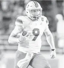  ?? MARK WALLHEISER/AP ?? Hurricanes quarterbac­k Tyler Van Dyke looks to lead UM into the postseason with a win over Virginia Tech.