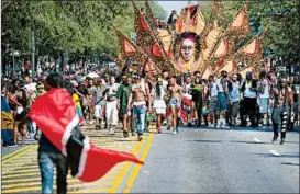  ?? CRAIG RUTTLE/AP ?? Revelers and participan­ts turnout for the West Indian American Day Parade in Brooklyn, N.Y., on Monday. The annual Carnival celebratio­n by New York’s Caribbean community began in the 1920s, first in Harlem and then in Brooklyn.