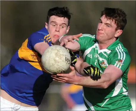 ??  ?? Cullen’s Sean Fleming and Kanturk’s James Fitzpatric­k seek out the ball in the E Tarrant &amp; Sons Skoda Duhallow JAFC in Dromtariff­e. Photo by John Tarrant