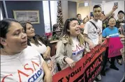  ?? ANDREW HARNIK / ASSOCIATED PRESS ?? Protesters take over the waiting room of the offices of Senate Minority Leader Sen. Chuck Schumer, D-N.Y., on Tuesday in Washington to demand that the Senate pass a clean DREAM Act.