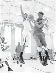  ?? By Evan Habeeb, U.S. Presswire
Inside and outside: James Young, right, facing USA West’s Marcus Lee on Friday, was 5-for-10 on three-point attempts Sunday. ??