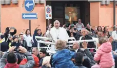  ?? ELISABETTA BARACCHI, EUROPEAN PRESSPHOTO AGENCY ?? Pope Francis waves to the crowd after celebratin­g a Sunday mass at Martiri’s square in Carpi, Italy. The pope visited Carpi and Mirandola, two towns hit by an earthquake in 2012.