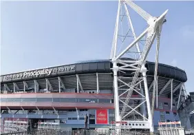  ??  ?? > Fearless cleaners abseil up the Principali­ty Stadium to ensure the venue is clean for the Champions League final