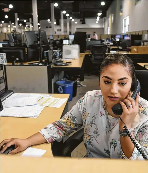  ?? Jerry Baker ?? Dispatcher Priscellia Villegas works the phone at privately held Houston company Sun Coast Resources.