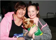  ??  ?? Ann Marie and Rachel Prendervil­le brought their dog Izzy to the CBS the Green 3K Run on Sunday.