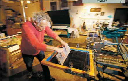  ?? PHOTOS BY LUIS SÁNCHEZ SATURNO/THE NEW MEXICAN ?? Joshua Sage makes fabric labels for canvas shades for his business, Shade Cloud Canvas Flies, at the screen printing studio at Warehouse 21 on Thursday. Some changes are coming to the teen center, including a name change. The organizati­on’s board plans...