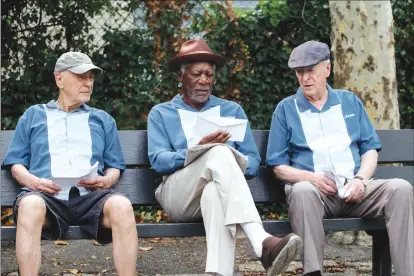  ?? Associated Press photo ?? In this image released by Warner Bros. Pictures, from left, Alan Arkin, Morgan Freeman and Michael Caine appear in a scene from “Going in Style.”