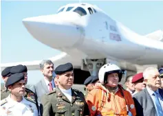  ?? — AFP photo ?? Padrino (second left) after the arrival of two Russian Tupolev Tu-160 strategic long-range heavy supersonic bomber aircrafts at Maiquetia Internatio­nal Airport, just north of Caracas.