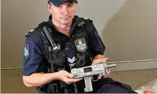  ?? Photo: Kevin Farmer ?? CONCERNING: Darling Downs Tactical Crime Squad Senior Constable Michael Glover with the homemade gun.