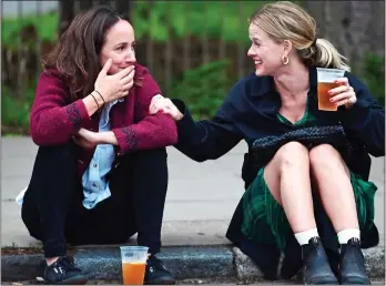  ??  ?? BEER AND GIGGLES: Old friends Alice and Lydia laugh uproarious­ly as they share a pint and some hilarious stories