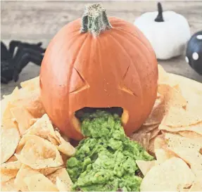  ?? SOMEWHAT SIMPLE ?? Halloween-themed guacamole “barfing” pumpkin.