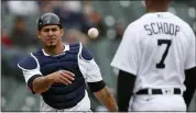  ?? RAJ MEHTA — THE ASSOCIATED PRESS ?? Detroit Tigers catcher Wilson Ramos tosses the ball to Jonathan Schoop during the first inning of Saturday’s game against the Kansas City Royals in Detroit.