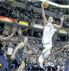 ?? MICHAEL CONROY/THE ASSOCIATED PRESS ?? Brooklyn Nets guard Jeremy Lin (7) shoots over Indiana Pacers forward Thaddeus Young (21) during the second half of an NBA basketball game in Indianapol­is, Wednesday.