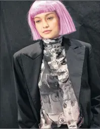  ?? AP PHOTO/MARY ALTAFFER ?? Model Gigi Hadid appears backstage Thursday before the Jeremy Scott collection is presented during Fashion Week in New York.