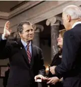  ??  ?? Vice President Joe Biden administer­s the Senate oath last week to Sen. Sherrod Brown (D-Ohio).