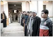  ?? MOHAMED EL-SHAHED/GETTY-AFP ?? Egyptians attend the funeral of a leader of the Al-Rawdah mosque, where 305 people were killed in an attack.